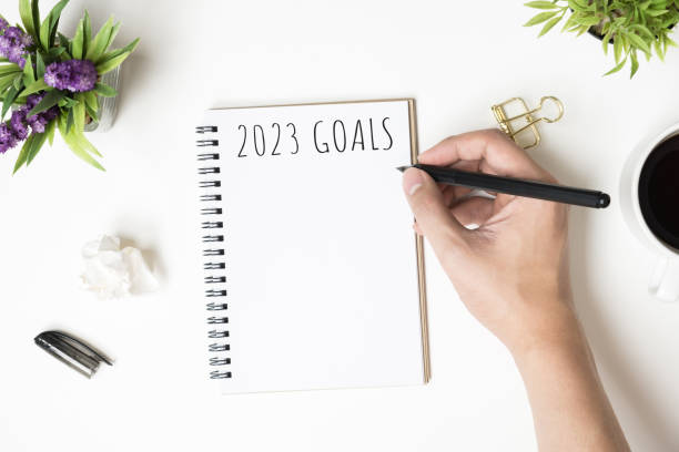 istock Notebook with 2023 goals text on it to apply new year resolutions and plan. 1446916527