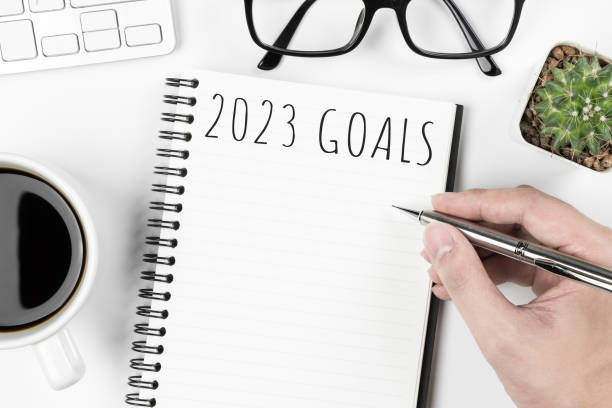 istock Notebook with 2023 goals text on it to apply new year resolutions and plan. 1446916531