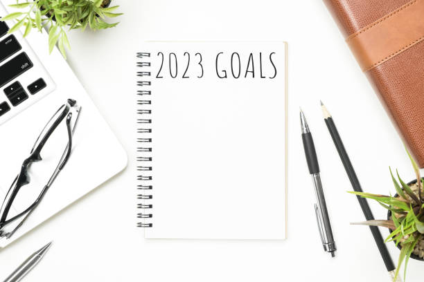 istock Notebook with 2023 goals text on it to apply new year resolutions and plan. 1446916565