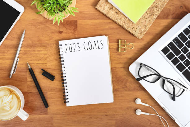 istock Notebook with 2023 goals text on it to apply new year resolutions and plan. 1446916624