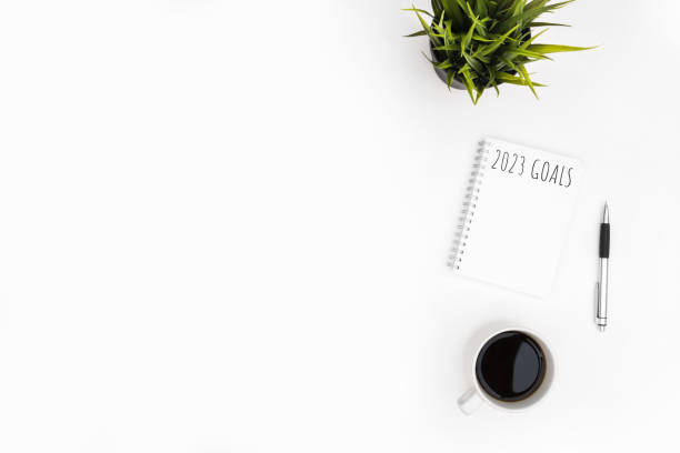istock Notebook with 2023 goals text on it to apply new year resolutions and plan. 1446916655