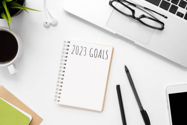 istock Notebook with 2023 goals text on it to apply new year resolutions and plan. 1446916722