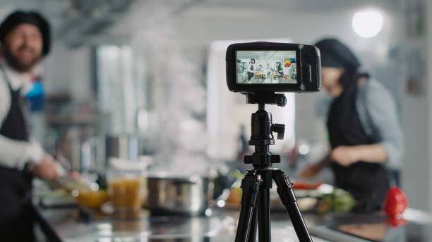 istock Professional camera filming culinary class on online cooking show 1446916798