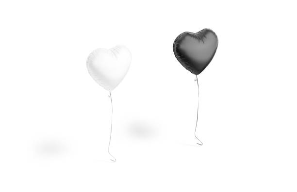Blank black and white heart balloon flying mockup, side view, 3d rendering. Empty hearts levitation decorative balloons mock up, isolated. Clear gift mylar or foil ball for festival date template.