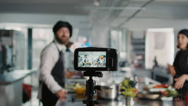 istock Camera filming people cooking professional menu dish 1446917655