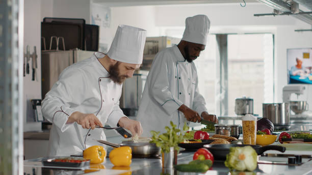 istock Authentic cook adding shredded parmesan on tasty dish 1446917706