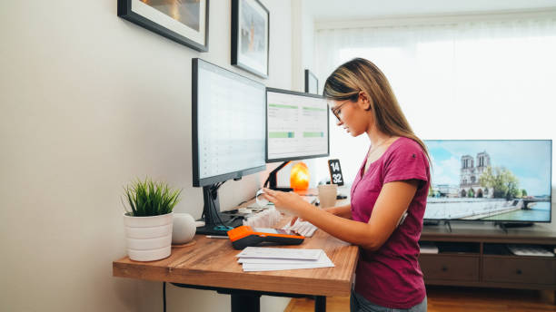 istock Woman working at standing desk 1446917866