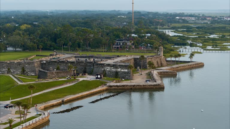 Castillo de San Marcos National Monument - the historic ancient Spanish fortress, the major tourist attraction and landmark in Saint Augustine, Florida. Aerial video with the panning camera motion.