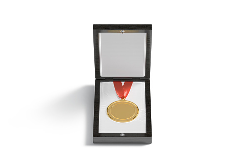 Blank gold medal in black wood box mockup, front view, 3d rendering. Empty golden gift medallion for 1 st place in competition mock up, isolated. Clear round award badge template.