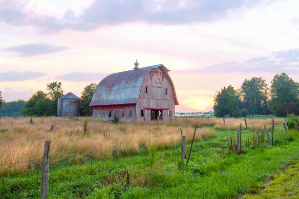 istock Old Weathered Red Barn at sunrise-Howard County, Indiana 1446919802