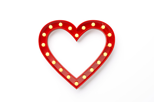 Light bulbs forming a red heart  shape on white background. Horizontal composition with clipping path and copy space.