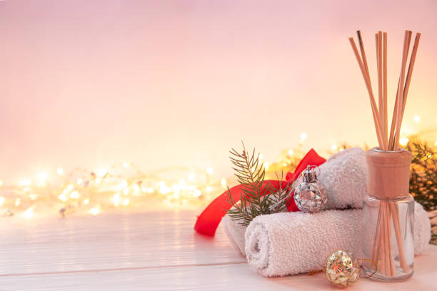 istock Christmas spa composition with incense sticks, towels and decor details. 1446920117