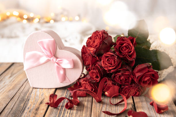 istock Composition for Valentine's Day with a gift box and a bouquet of roses. 1446921152
