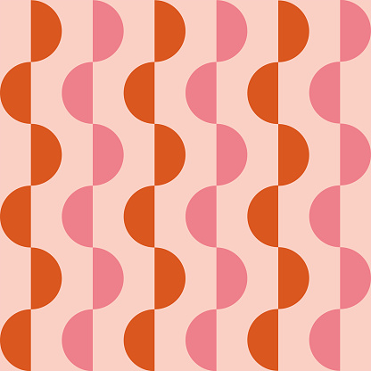 Mid century modern abstract small orange and pink half circles seamless pattern. For home decor, wallpaper and textile