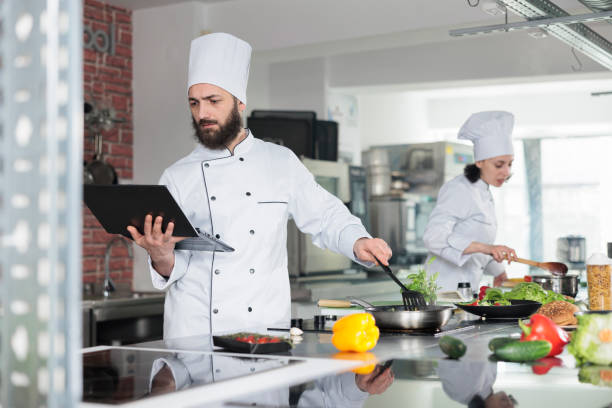 istock Gastronomic expert preparing dish garnish using fresh organic ingredients 1446922853