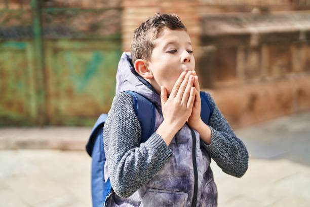 istock Blond child student standing with surprise expression at street 1446924356