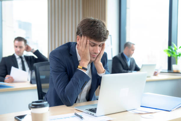 istock Young Asian businessman tired from work. 1446925521