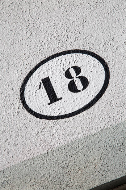 istock Number Eighteen on Stone Wall on Diagonal Tilt 1446925968