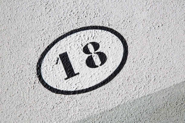 istock Number Eighteen on Stone Wall on Diagonal Tilt 1446926339
