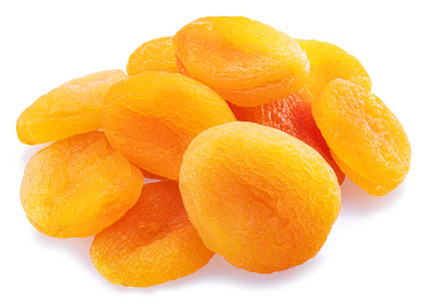 istock Delicious dried apricots isolated on white background. Macro shot. 1446933710