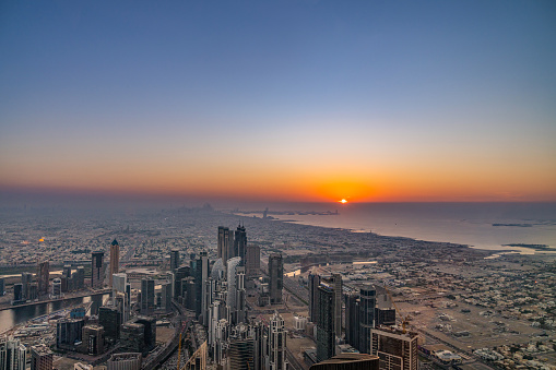 Dubai, United Arab Emirates - November 24, 2022; Aerial view of Burj Khalifa in Downtown skyline. Business and financial area in smart urban city during sunset at Burj Khalifa