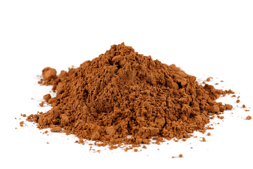 Cocoa powder heap on white isolate