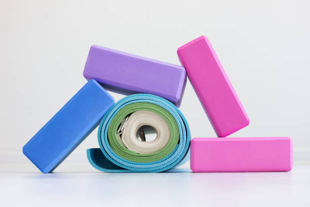 istock Varicolored iyengar yoga props. Blocks, strap and carpets 1446936860