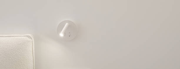 istock Bedside white LED wall lamp illuminating. Creative modern wall light source in bedroom. 1446937140