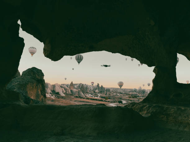 special media work with drone at sunrise in cappadocia - spy balloon stok fotoğraflar ve resimler