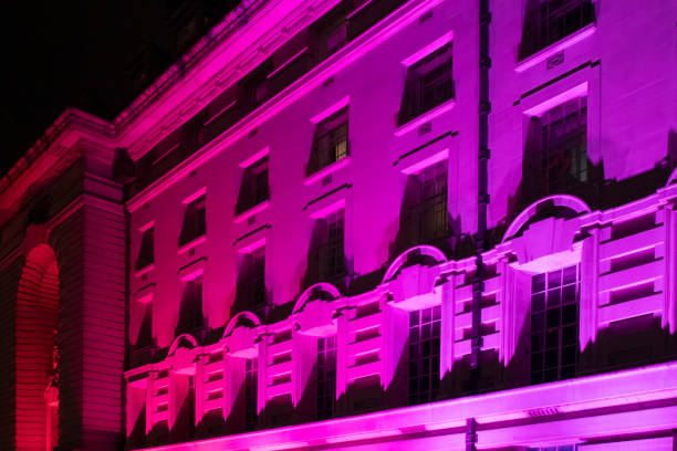 County Hall on the South Bank of the Thames at Westminster County Hall on the South Bank of the Thames at Westminster. It is lit in bright coloured floodlights. london county hall stock pictures, royalty-free photos & images