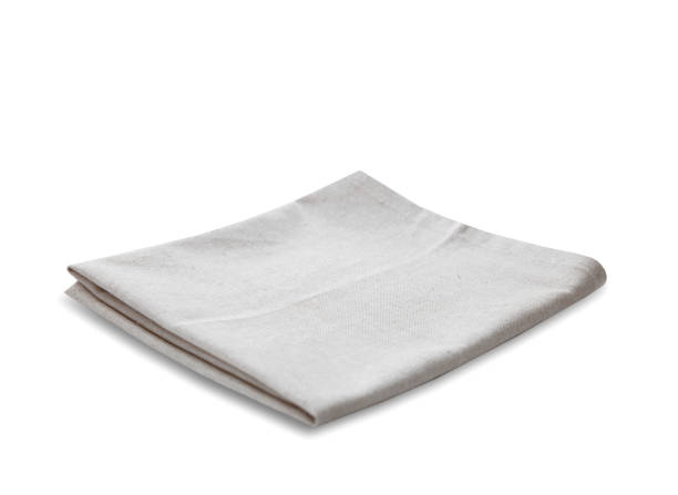 istock Kitchen towel isolated on white. Folded cloth.Food serving design element. Square napkin. 1446942499