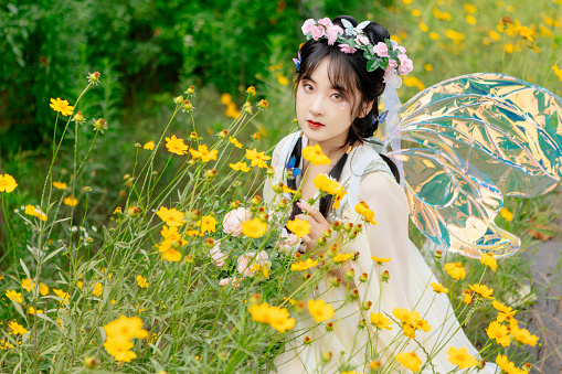 An Asian beauty was outdoors in a Chinese costume,
