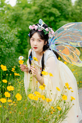 An Asian beauty was outdoors in a Chinese costume,