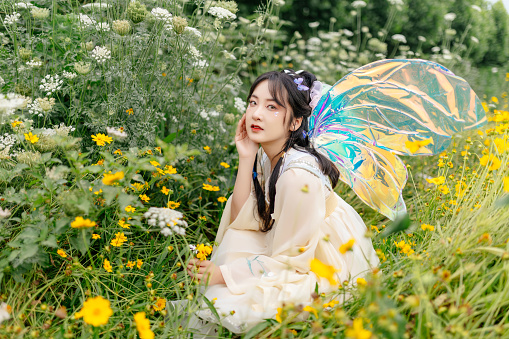 An Asian beauty was outdoors in a Chinese costume,