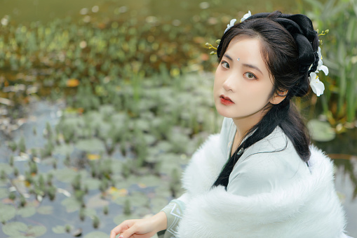 Asian Hanfu Beauty Feels Nature in Outdoor Rainy Weather