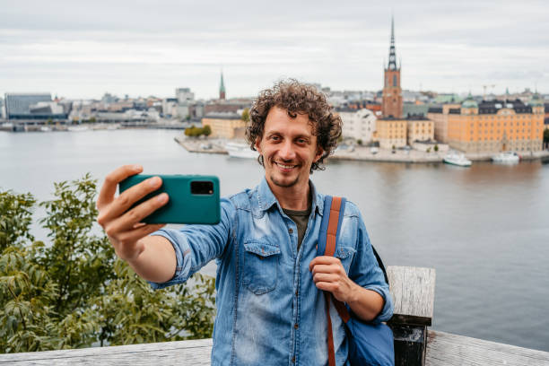 istock Young Man Taking Selfies At A High Viewpoint In Stockholm 1446944683