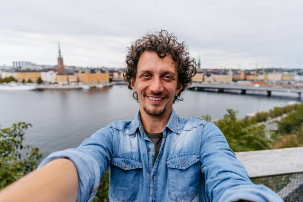 istock Young Man Taking Selfies At A High Viewpoint In Stockholm 1446944700