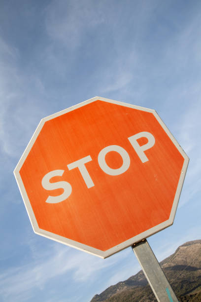 istock Red Stop Sign in Rural Setting on Diagonal Tilt 1446944880