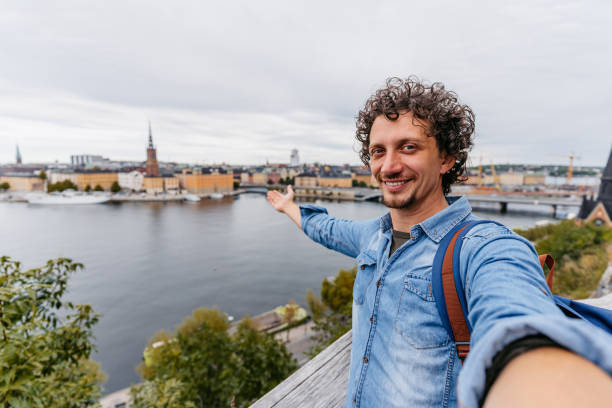 istock Young Man Taking Selfies At A High Viewpoint In Stockholm 1446944900