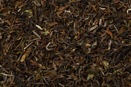 Tasty Rungmook Darjeeling Tea dried tea leaves close up full frame as background
