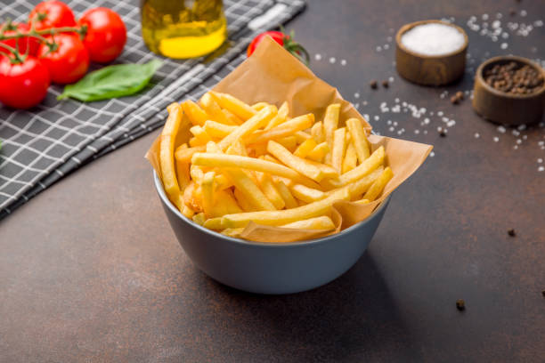 istock french fries on bowl on brown dark table 1446945948