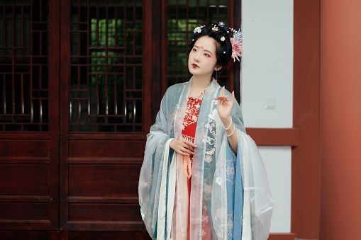 Asian Hanfu Beauty in Front of Chinese Architecture