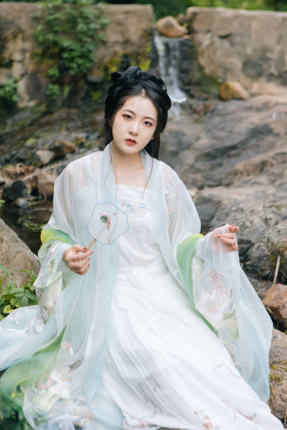 istock Asian Hanfu beauties rest outdoors 1446947015