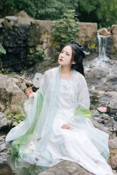istock Asian Hanfu beauties rest outdoors 1446947025