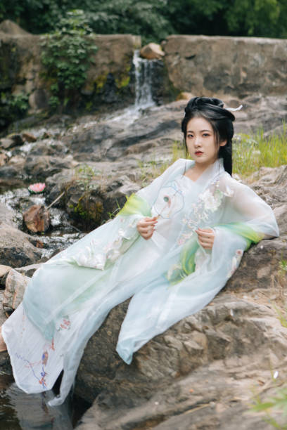 istock Asian Hanfu beauties rest outdoors 1446947035