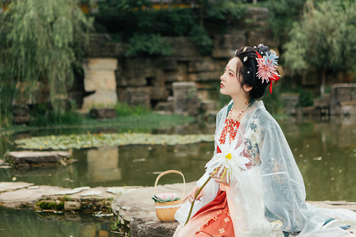 Portrait of Asian Hanfu Beauty Resting by the River