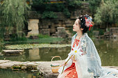 istock Portrait of Asian Hanfu Beauty Resting by the River 1446947161