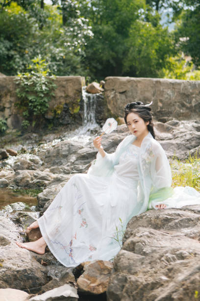 istock Asian Hanfu beauties rest outdoors 1446947201