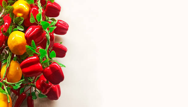 istock vertical rows of bright artificial red peppers and yellow lemons on a light background with space for text 1446947603