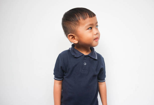 istock Two year toddler smiling curious looking at white space. Think and curiosity 1446948973